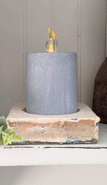 cement look pillar timer candle