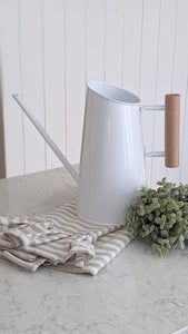 white metal watering can , vintage style