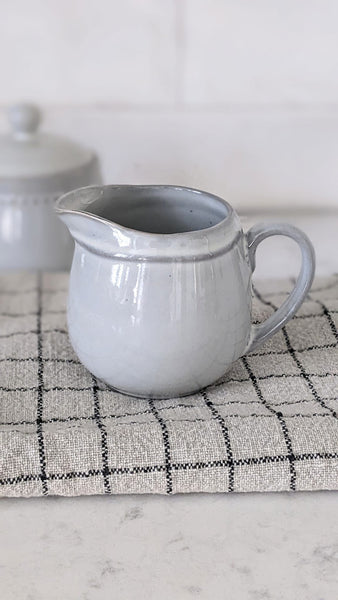 gray ceramic milk creamer